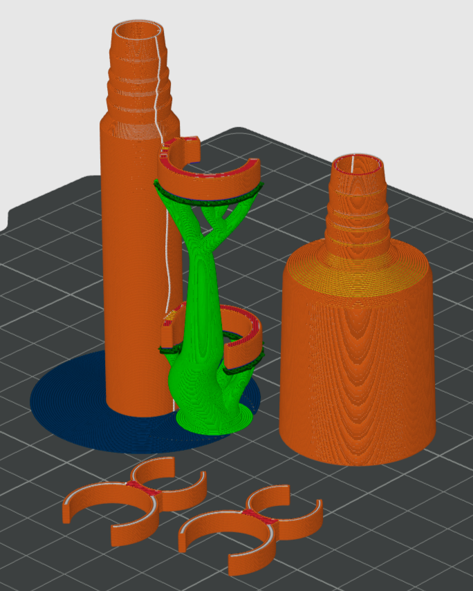 3D-Druckmodell, orange und grün.